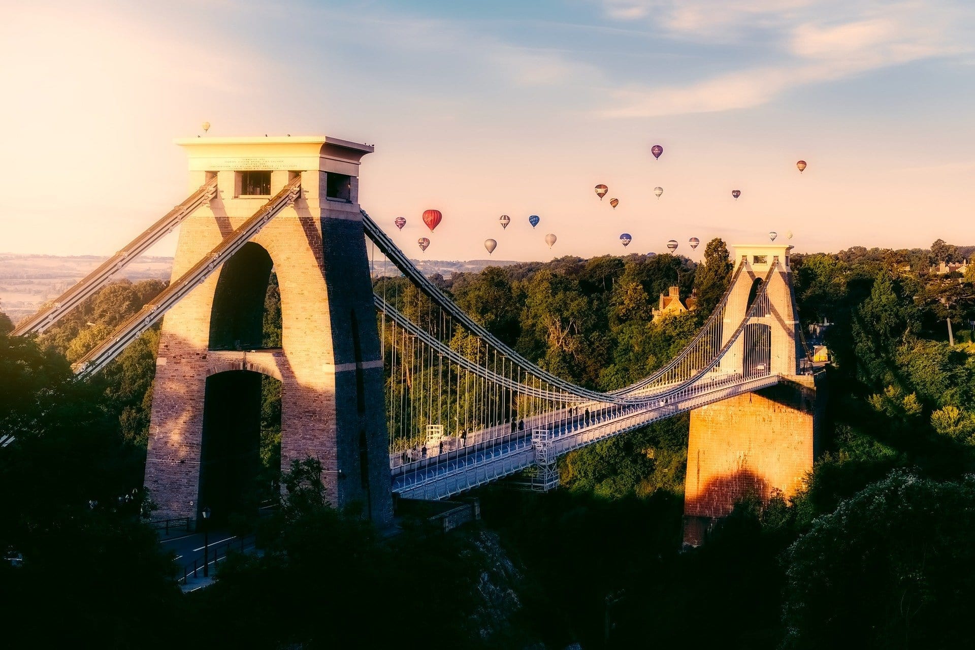 image of a large bridge with hot air balloons in the sky